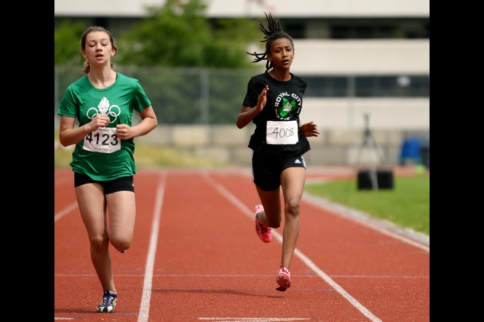 Closing in on the finish line is Lishan Melles-Hewitt, at right, of the Royal City Track and Field Club. The Div. 12 girls competitor placed second in the 1200-metre race.