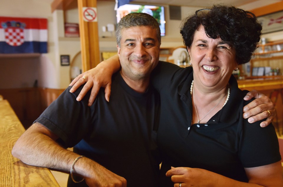 Perry E embraces bartender Maria Budiscak at the Croatian Cultural Centre’s members lounge in antici