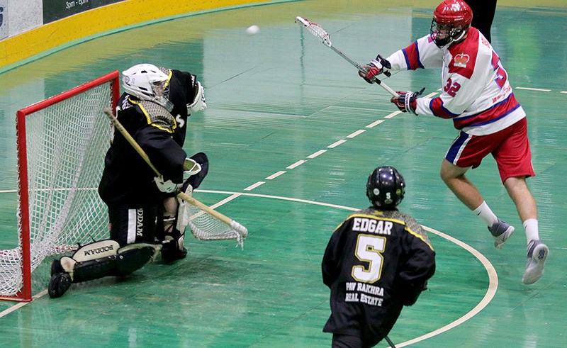 New Westminster Salmonbellies forward Keegan Bell scores on PoCo Saints goalie Cam Overby late in the first period to make it 6-0, en route to a 10-3 win and three game sweep of their best-of-five BC Junior A Lacrosse League semifinal, Tuesday at New Westminster's Queen's Park Arena.