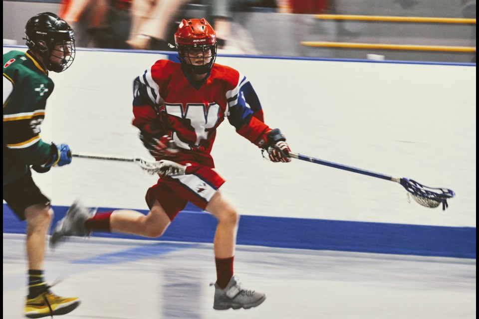 New Westminster's Lucas Nielsen dashes past a Vancouver check during provincial bantam A2 championship action.