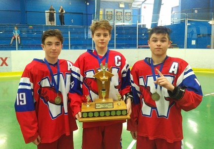 Celebrating their A2 bantam championship are New Westminster Salmonbellies' Reid Hinds-MacDonald, Adam Guthrie and Josh Faria.