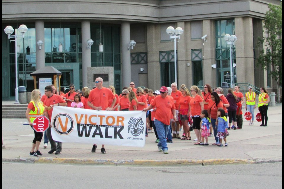 About 60 people took to the streets of downtown Prince George during Saturday's Victor Walk, a movement that raises awareness of the plight of millions of Canadians who have survived childhood sexual abuse.