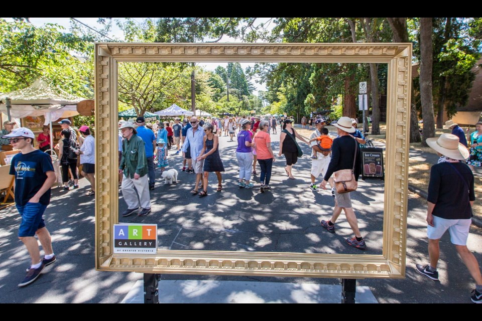 A crowd of art lovers walk through an Art Gallery of Greater Victoria picture frame during the 31st TD Art Gallery Paint-In on Saturday.