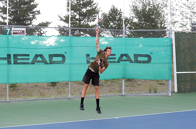Cory Fleck smashes a serve on Sunday at Prince George Tennis Club during the A-singles final of the Prince George Citizen Open tennis and pickleball tournament. Citizen Photo by James Doyle