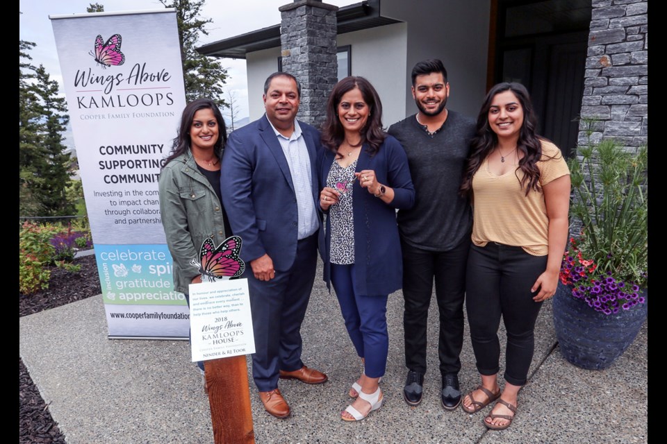 RJ and Ninder Toor (second and third from left) and their kids will soon move into the Wings Above Kamloops home in Aberdeen after their sealed bid was chosen from all received. Money raised from the fundraiser will be used to finance expansion of the Marjorie Willoughby Memorial Hospice Home.