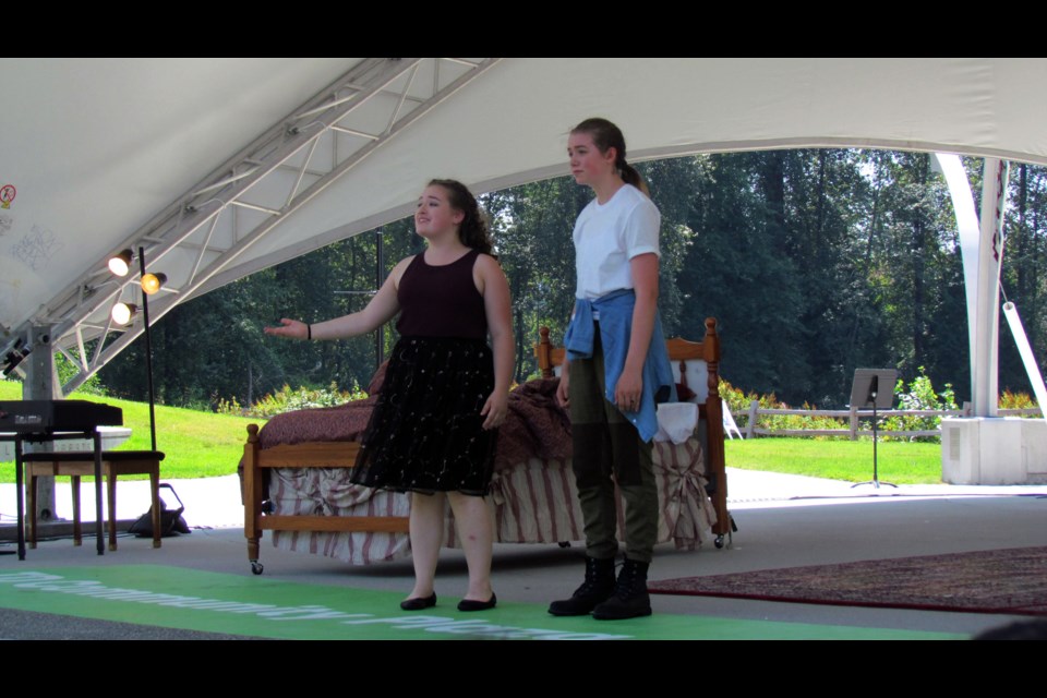 Samantha Kerr (right) as Romeo and Julia MacLean as Juliet in the Place des Arts' production at TD Community Plaza.