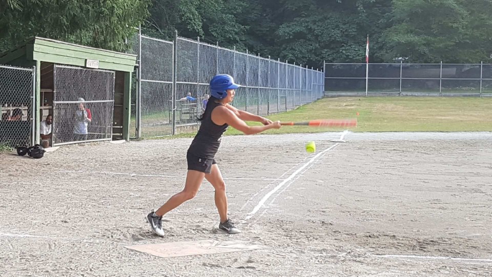 Logger teammate Nancy Lee swings for a ball Tuesday night.