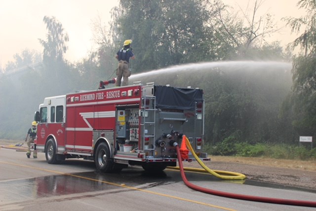 Fire crews battle the blaze on DND lands. Photo: Shane MacKichan