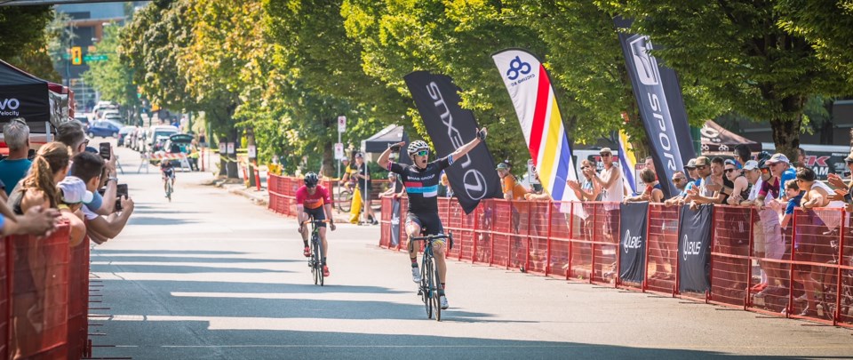 A cyclist crosses the finish line in the Awesome Grand Prix.