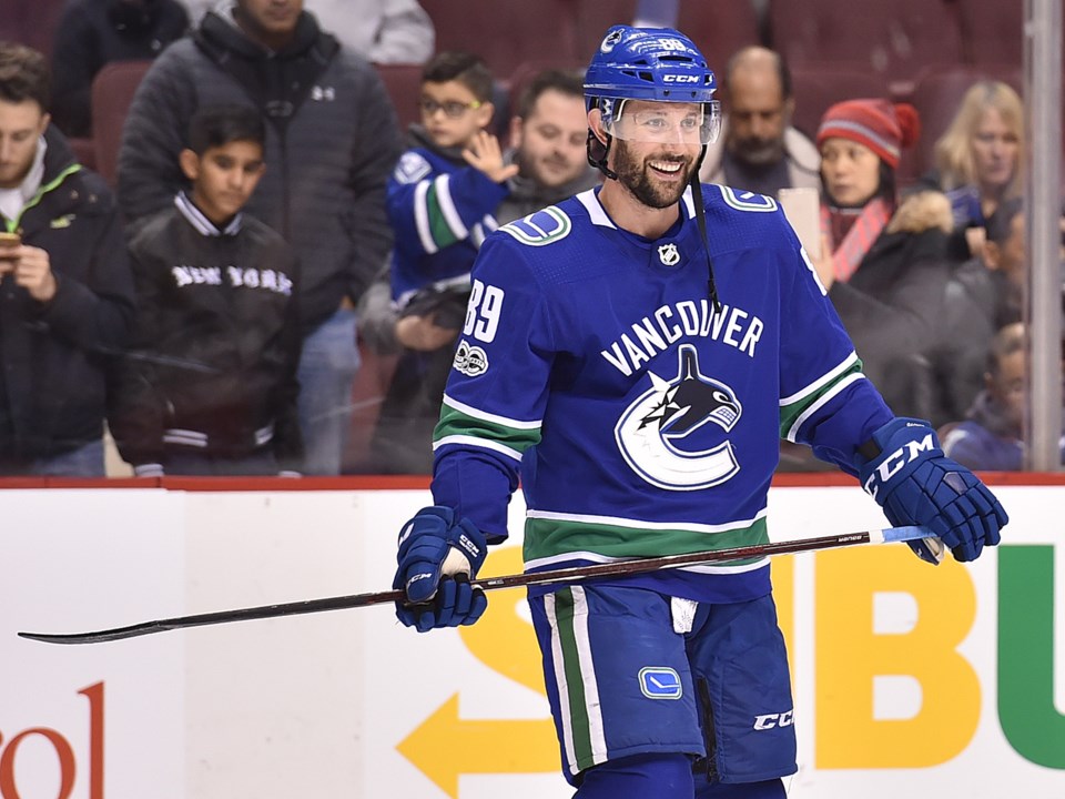 Sam Gagner smiles while warming up with the Canucks.