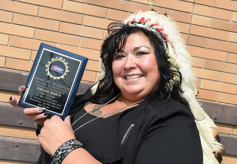 Prince George's Dawn Murphy shows an award she received from All Star Wrestling. – Citizen photo by Brent Braaten