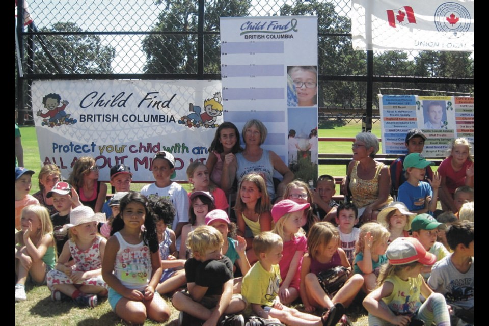 Crystal Dunahee, centre, with some of the participants at a previous Slo-Pitch Tournament of Hope. This year&ecirc;s event runs next weekend at Topaz Park to raise funds for Child Find B.C.