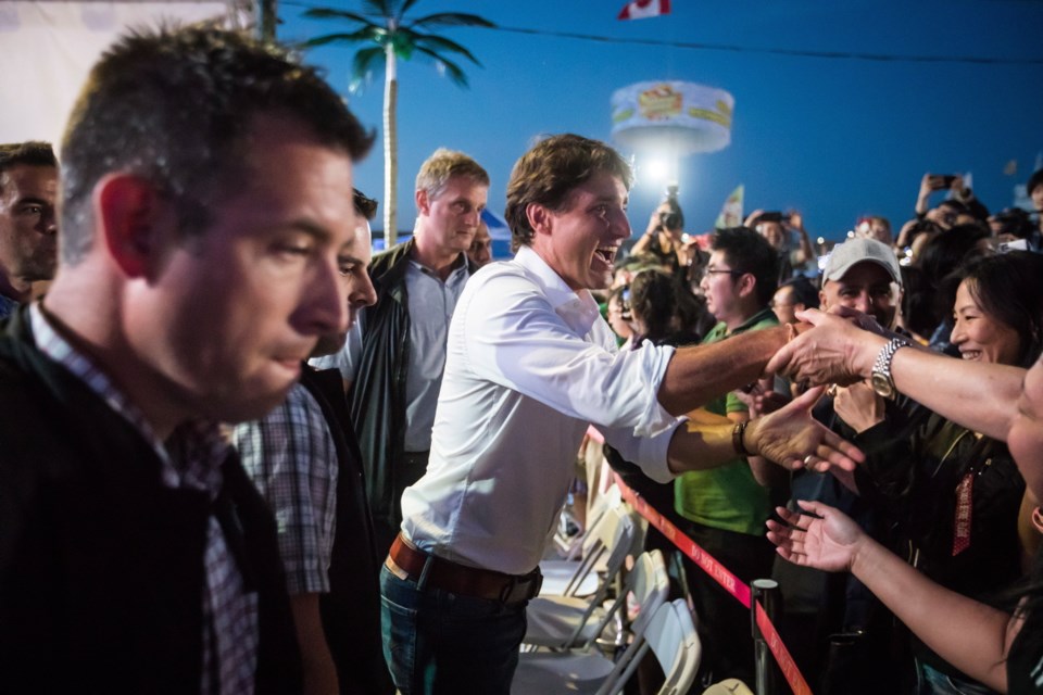 Prime Minister Justin Trudeau, centre, greets people during a visit to the Richmond Night Market in Richmond, B.C., on Saturday August 4, 2018. THE CANADIAN PRESS/Darryl Dyck
