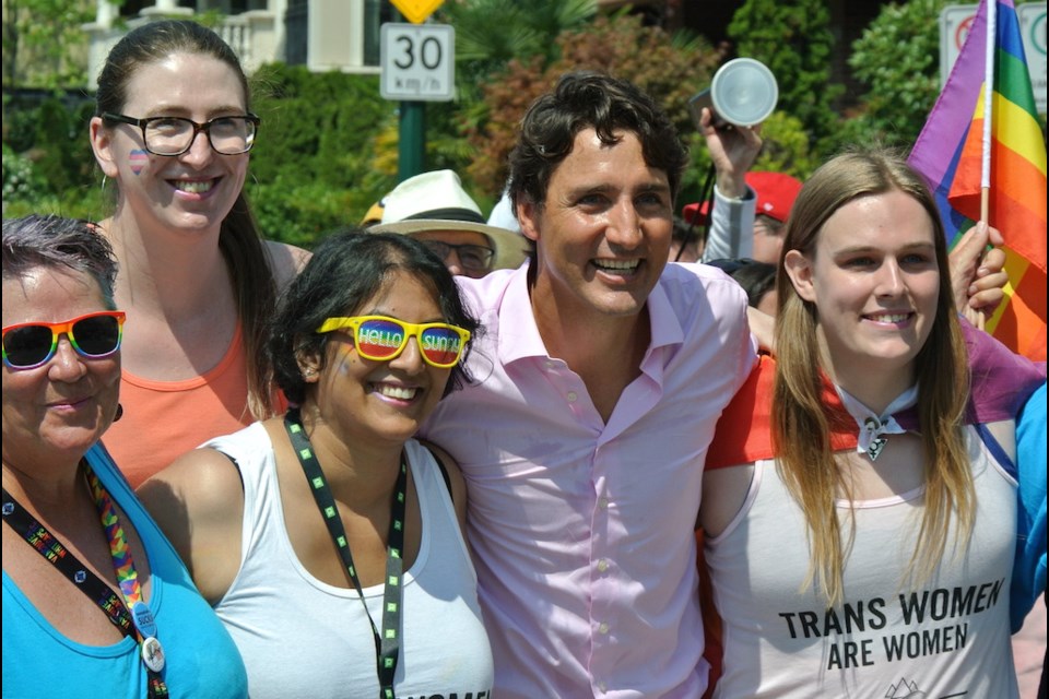 Prime Minister Justin Trudeau pauses for a group shot in Sunday's Vancouver Pride Parade.