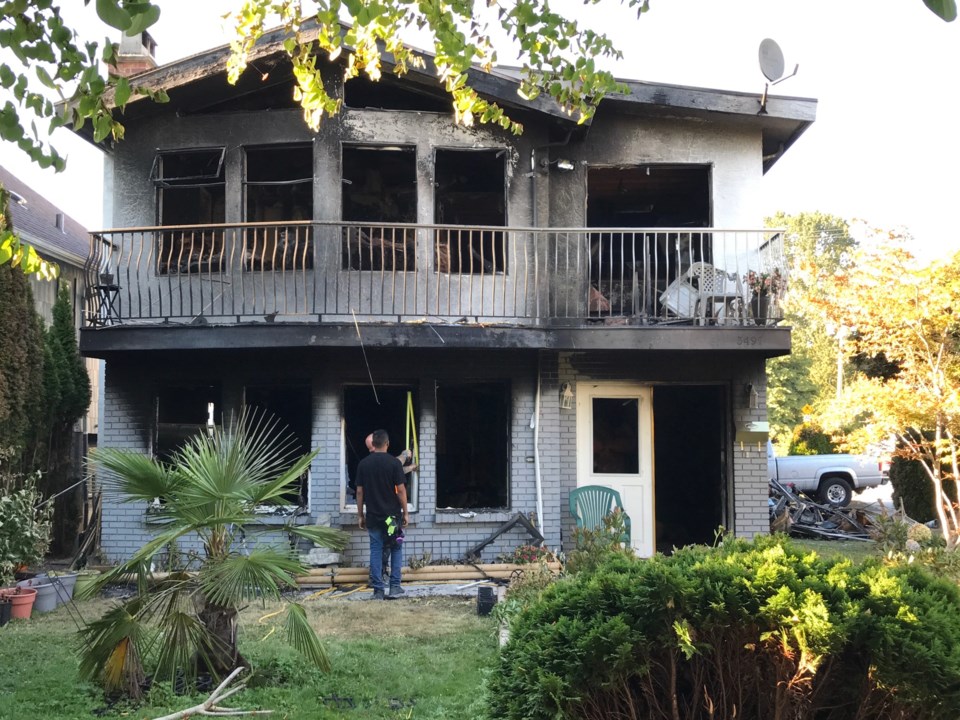 A fire gutted an East Vancouver home Aug. 7. One person died. Photo Naoibh O'Connor