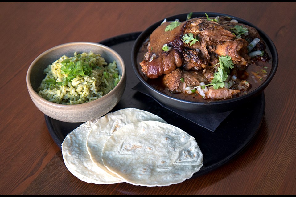 Chamorro, an entire chili-braised ham hock served with tortillas and rice, is one of the items on el Santo's new brunch menu.