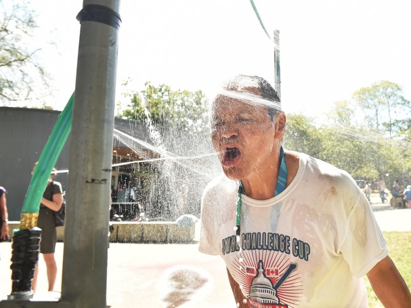 Alvin Hackett cools off using a newly-installed misting station at Oppenheimer Park. Photo Dan Toulg