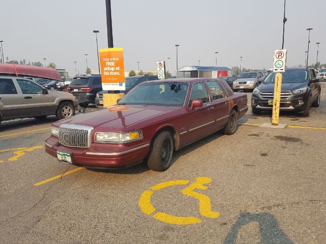 A reader sent along photos of a car taking up two spaces in the zone reserved for the disabled in front of the Wal-Mart on Wednesday evening. To boot, it lacks a placard allowing the driver to take up even one space. The licence plate number is HJM.
