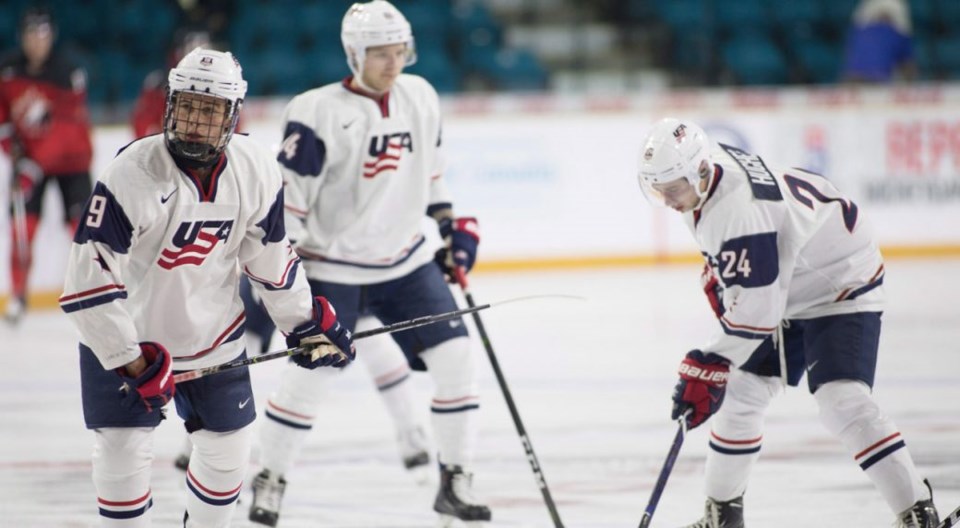 Jack Hughes and Quinn Hughes warming up with Team USA
