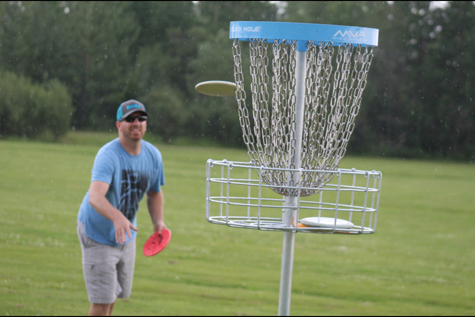 Clint Warkentin sinks a putt at the first ever Professional Disc Golf Association tournament in Northern BC.