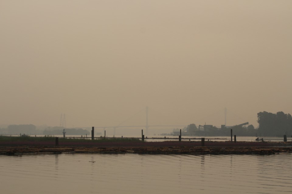 A haze has once again blanketed New Westminster. This is this morning's view from Sapperton Landing, looking towards the almost-invisible Port Mann Bridge.