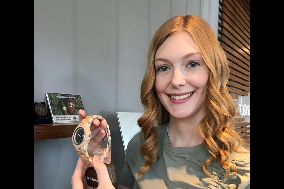 Taryn Liebholz, marketing co-ordinator for Tense Watch Canada, which has its office and factory in Port Coquitlam, holds an example of one of its products that’s shipped worldwide.