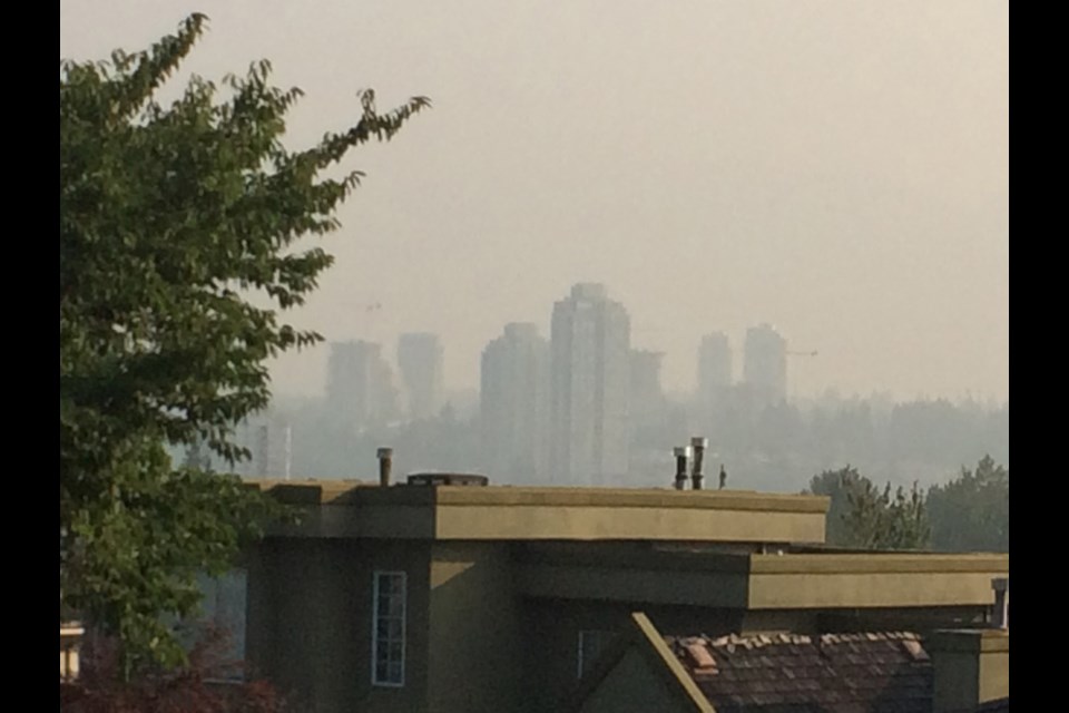 Views from Cariboo Heights this morning still show Burnaby shrouded in haze, though the air quality is on an improving trend.