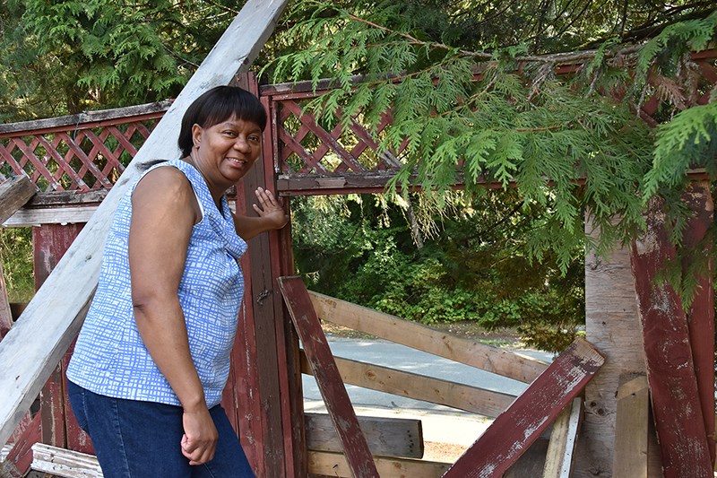 Titi Molefe surveys the damage left by a bear running through her property in search of food in the New Horizons neighborhood. On Friday, a trap was set in front of her house on Esperanza Drive, giving Molefe a sense of relief that something is being done about the bruin.