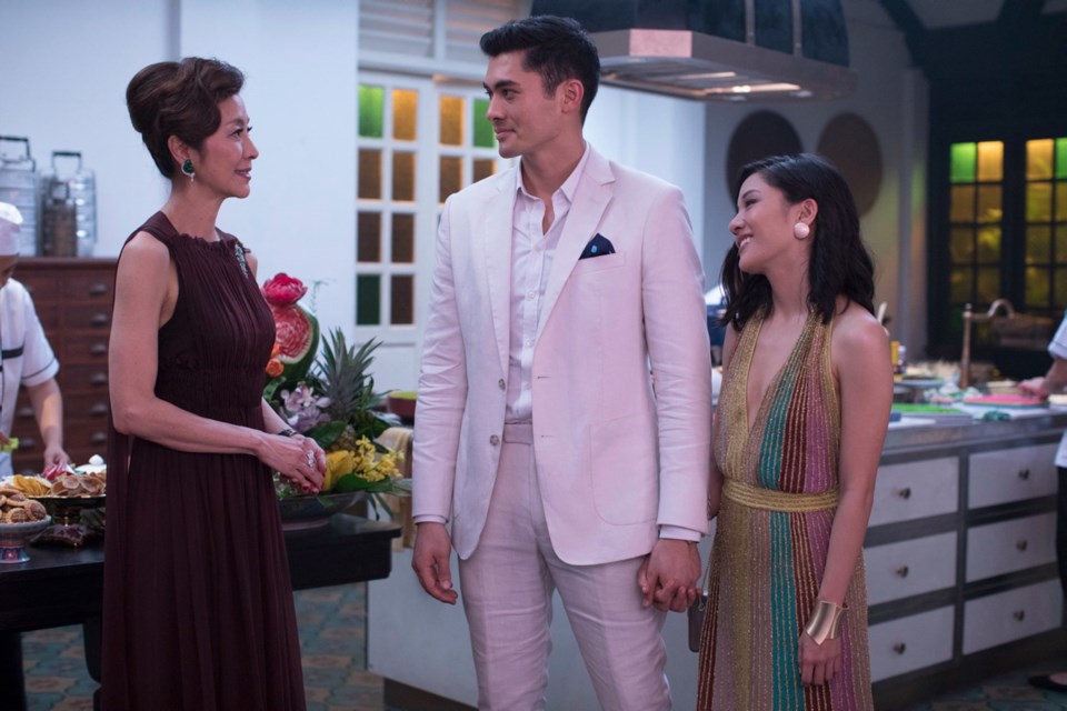 Michelle Yeoh, Henry Golding and Constance Wu star in Crazy Rich Asians, the most popular film in North America this weekend.