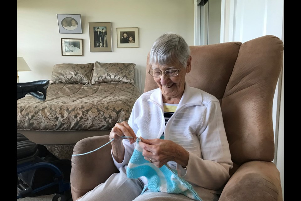 Dorothy Turner, knitting a toque for a needy Squamish resident.