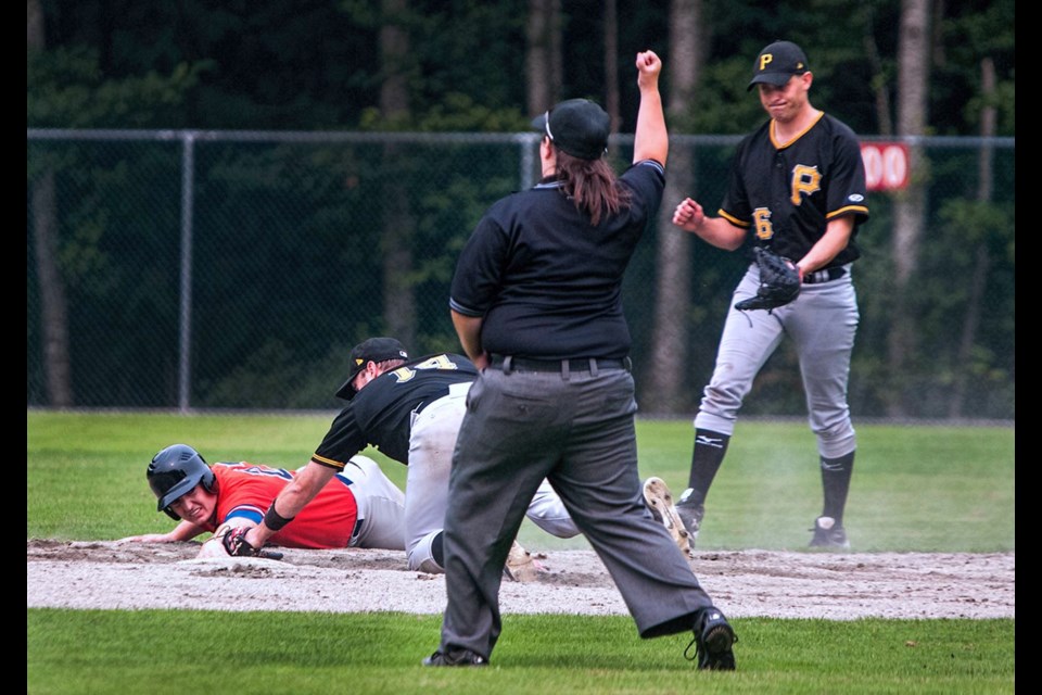 Burnaby Pirates’ Stu Holloway tags Howe Sounds’ baserunner Spencer Barnard out at second during Sunday’s Lower Mainland over-30 baseball league quarterfinal at Queen’s Park Stadium. The Hounds held on for a 9-5 victory over the scrappy Pirates. The playoffs continue for two other Burnaby teams this weekend at Queen’s Park.