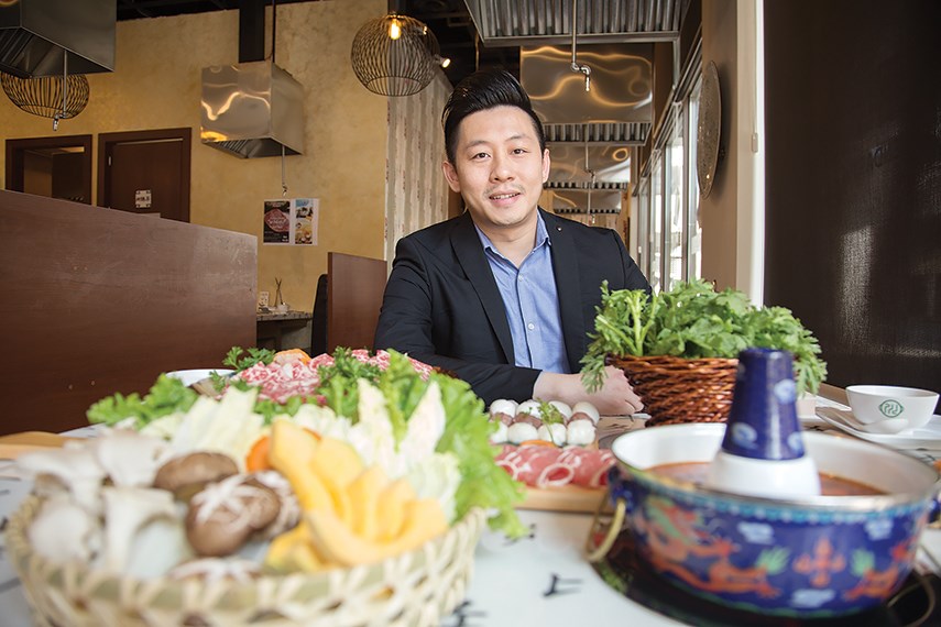 Legendary Hot Pot manager Nick Ma with some of the dishes available at the Park Royal restaurant.