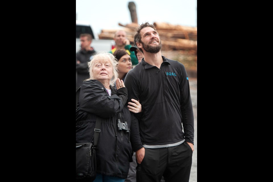 Mike Racicot's mother Brenda Gardner with Mike's close friend and fellow base jumper Phil Moessinger watch base jumpers on the Chief.