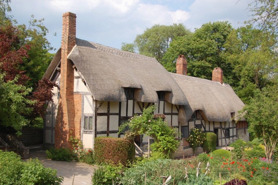 The thatched roof of Anne Hathaway's Cottage, where Shakespeare's wife grew up, seems to drip over the 500-year-old building.