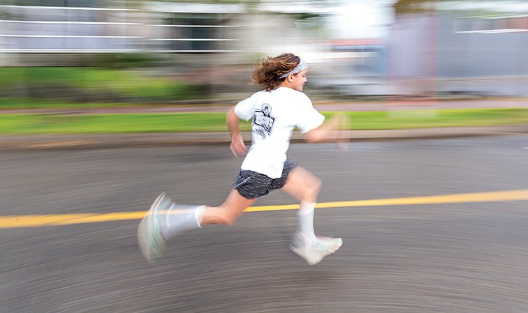 Natalie Hoehn, 8, sprint down Canada Games Way while racing in the 46th annual Labour Day Classic Kids Fun Run Sunday at Canada Games Plaza.