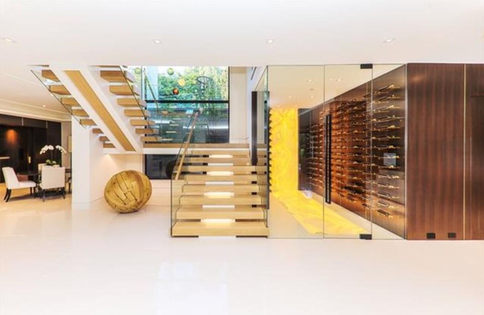 British Properties contemporary mansion stairs and wine room