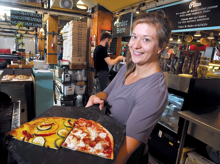 Melanie McCready, owner of Bowen Island Pizza Company, shows off some of the options available in their ever-rotating offerings.