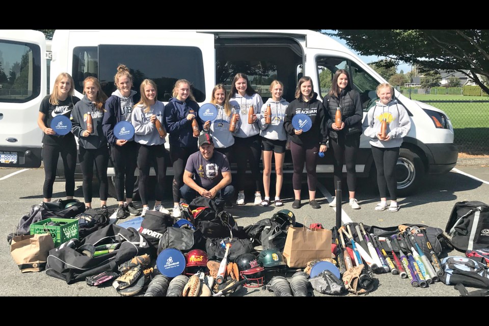The travelling 140 Sports contingent headed to Port Hardy last month with a van full of softball equipment to donate.