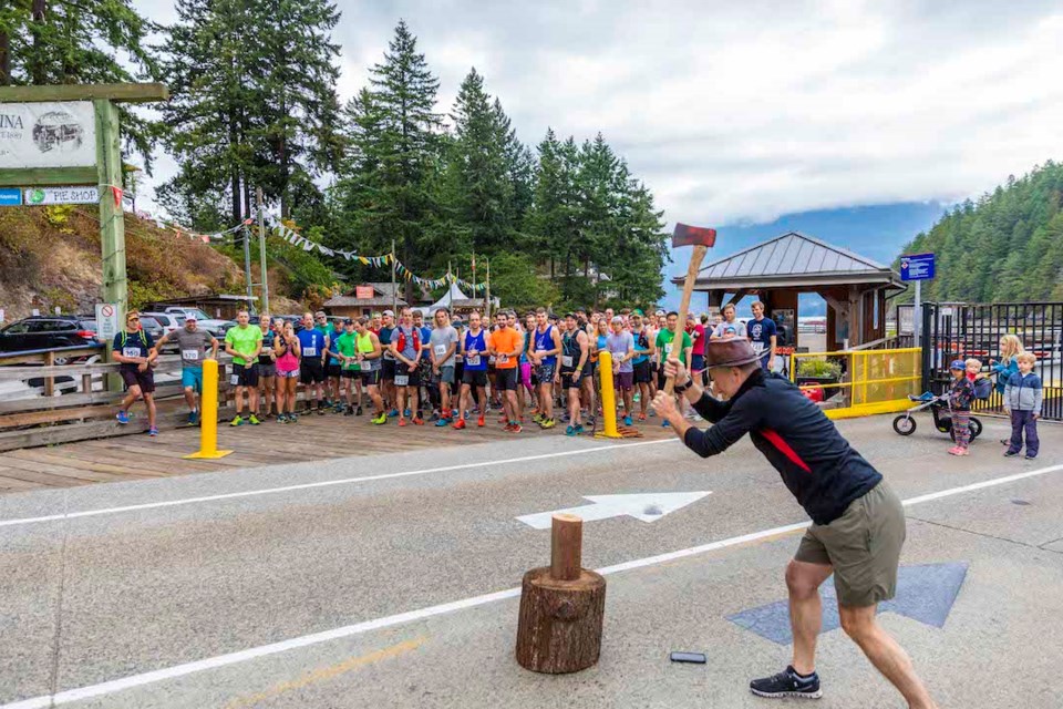 The fifth annual Handloggers Half Marathon began with the ceremonial wood chop.