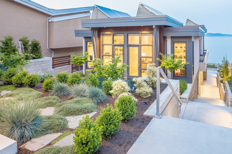 Christopher Walker of Christopher Developments designed and built the Cordova Bay house. The drought-tolerant garden is by Zenith Developments Landscaping.