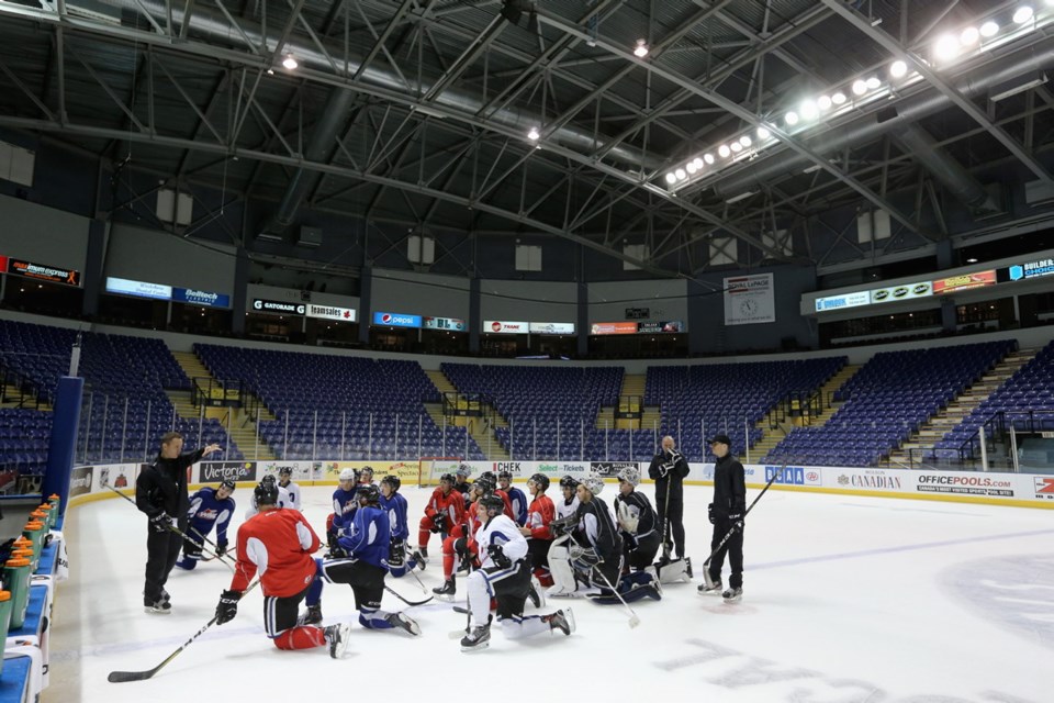 Victoria Royals players listen to coach Dan Price during a practice at Save-on-Foods Memorial Centre.