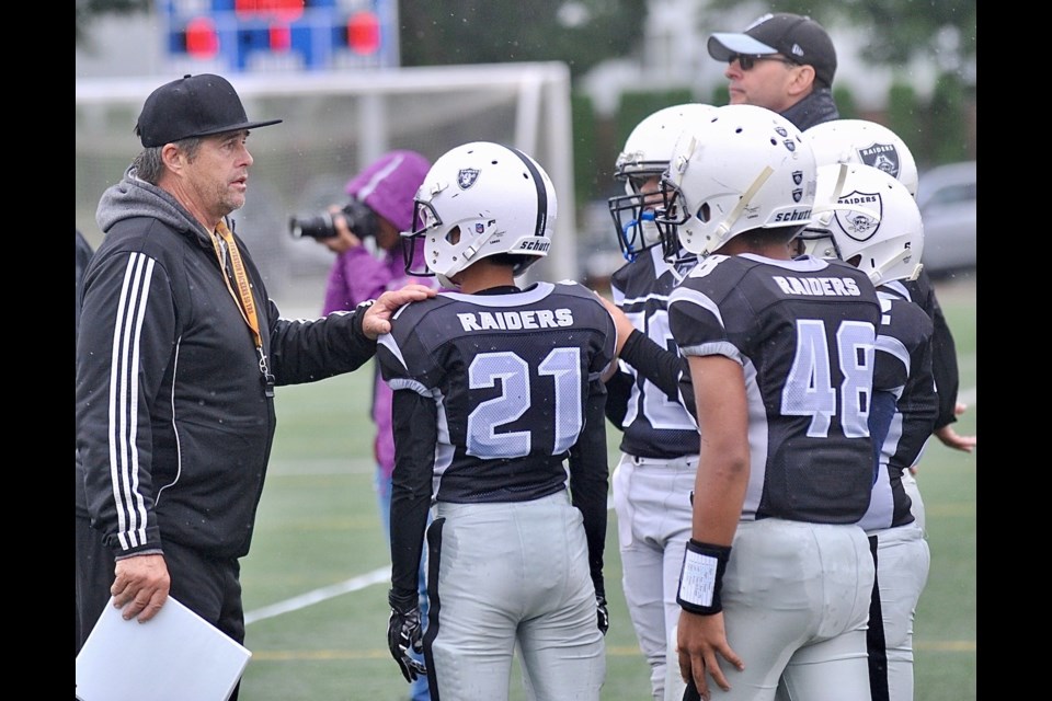 Richmond Junior Bantam Raiders coach Greg Jensen talks to his players during a 24-6 home field win over Royal City Hyacks. The Raiders will be looking to continue their win streak on Sunday against Westside.