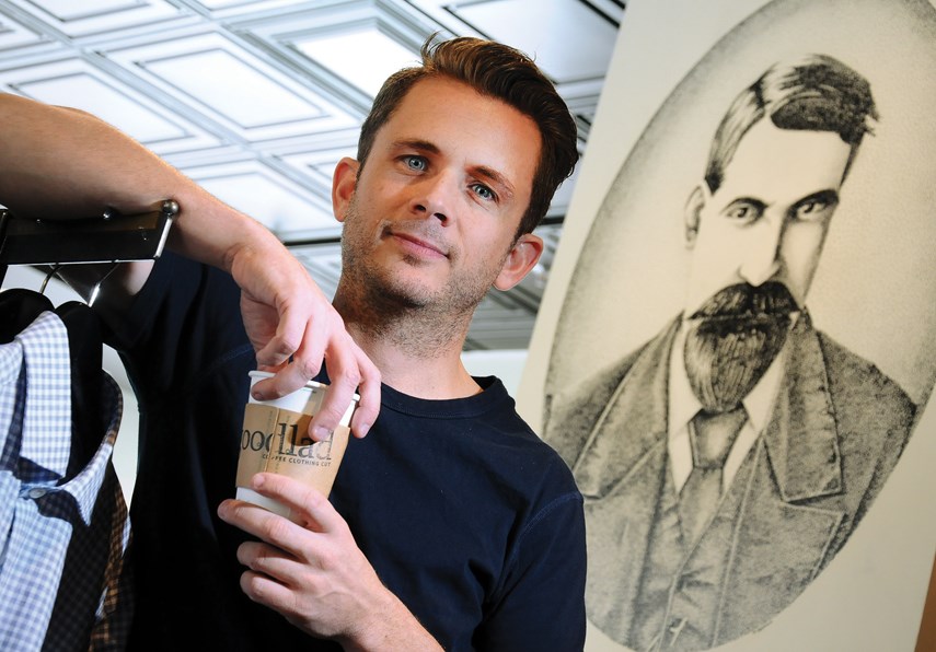 Shane Meier pauses for reflection near an art piece honouring his great, great grandfather James Goodlad, whose name now graces the coffee, cuts and clothing shop Meier opened up a month ago in Lower Lonsdale. photo Cindy Goodman, North Shore News