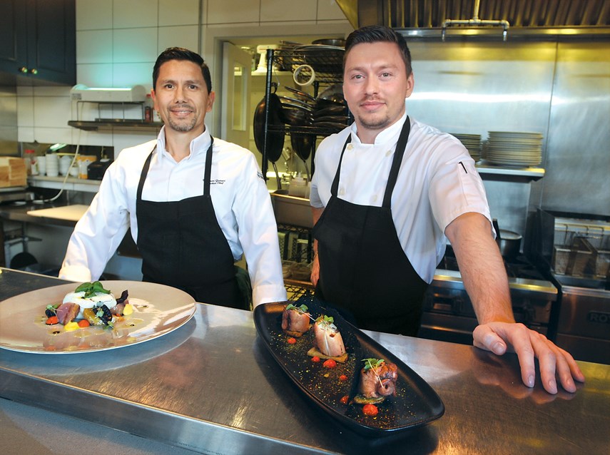 Executive chef and owner Weimar Gomez (left) and chef Gleb Podshibyakin with Salade de Burrata and Poulpe (octopus) at Rive Gauche in West Vancouver.