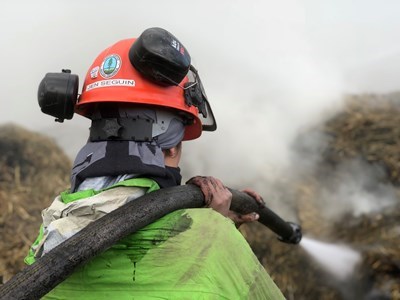 Jennifer Seguin works the hose on a fire outside of Merritt this summer