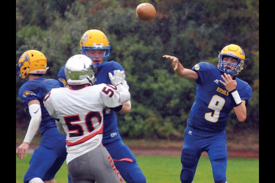 Handsworth Royals quarterback Ryan Jensen fires a pass during a matchup against New West Saturday. The Royals will face their cross-town rivals the Carson Graham Eagles in the annual Buchanan Bowl this Saturday at Carson. photo Paul McGrath, North Shore News