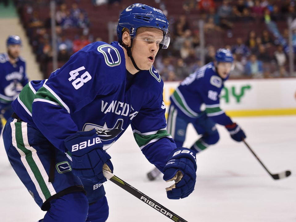 Olli Juolevi defends during a preseason game with the Vancouver Canucks.