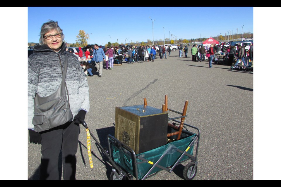 Susan Driedger from Vanderhoof pulled her many treasures behind her as she browsed through thousands of items available for sale during the Junk in the Trunk Sale held Saturday at CN Centre's parking lot.