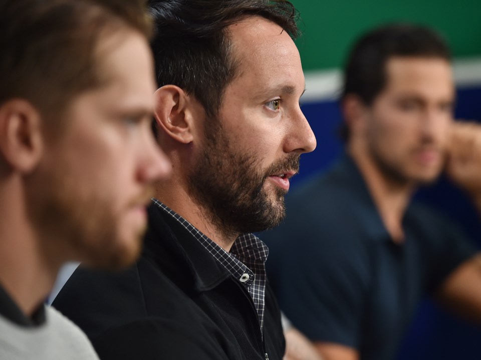 Sam Gagner speaks to the media at Canucks training camp in 2018.