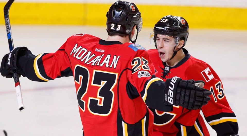 Sean Monahan and Johnny Gaudreau of the Calgary Flames celebrate a goal.